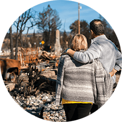 couple-looking-at-fire-destruction