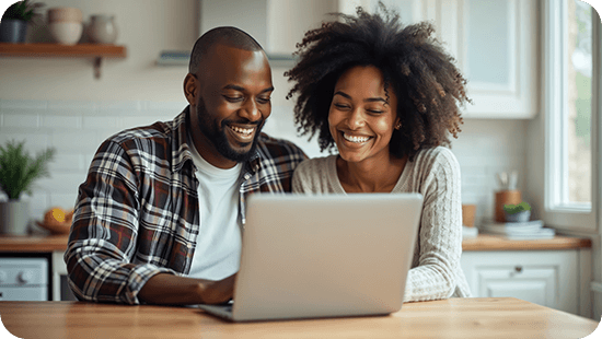 happy-couple-viewing-loan-on-laptop