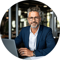 business-man-sitting-at-desk-with-laptop