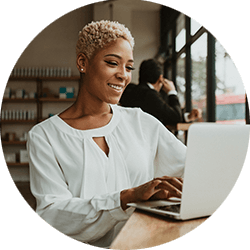 woman-looking-at-laptop-in-coffee-shop