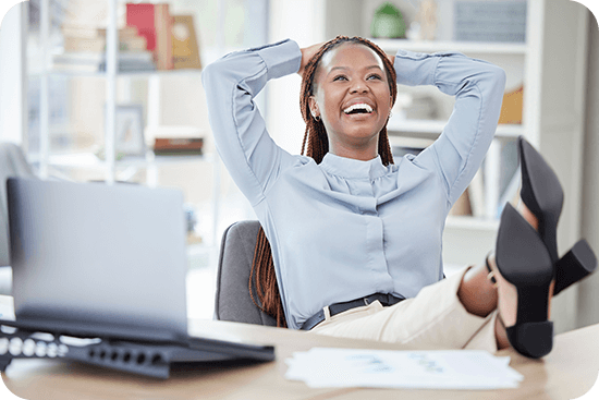 woman-sitting-at-desk-with-feet-propped-up