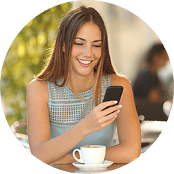 women-at-coffee-shop-looking-at-phone