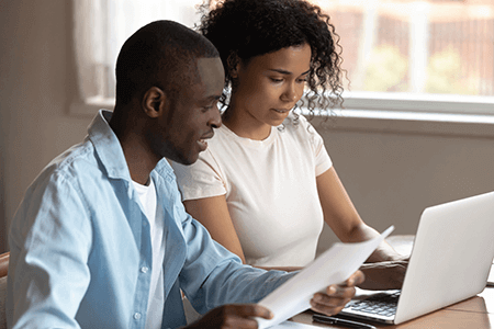 Couple accessing loan information online